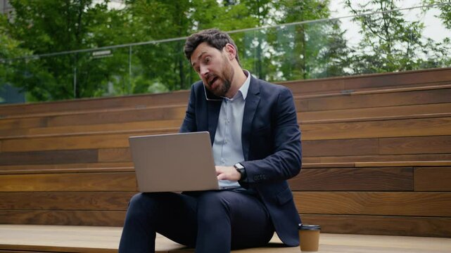 Angry businessman busy employer call smartphone arguing fight mobile phone conversation quarrel male guy irritated annoyed mad business man entrepreneur in city problem work laptop trouble outdoors