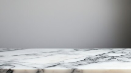 Fototapeta premium White marble countertop against gray wall.
