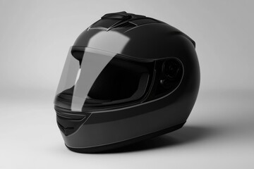 Fototapeta premium A close-up shot of a black motorcycle helmet on a white background, perfect for use in travel or sports-themed projects