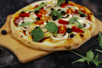 Close-Up of Pizza with Meat, Fresh Vegetables, and Melting Cheese