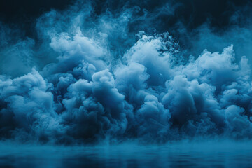 Naklejka premium Blue smoke billows from a smoke bomb creating an ethereal atmosphere in an outdoor setting during a vibrant event