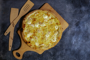 Hot Cheese Pizza with Melting Mozzarella on Wooden Board