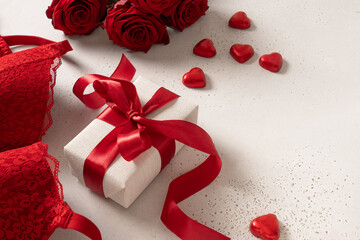 Valentine's day romantic sensual concept. Red lace lingerie, bustier underwear, candy sweets and...