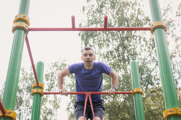 Fototapeta premium Muscle-Up Training on Outdoor Bar