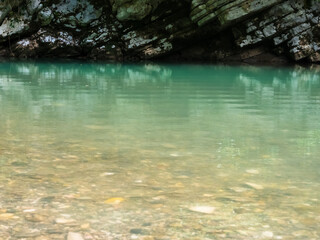 The river, with its rapid flow and majestic cliffs, creates a breathtaking landscape, reflecting the strength and beauty of the wild nature