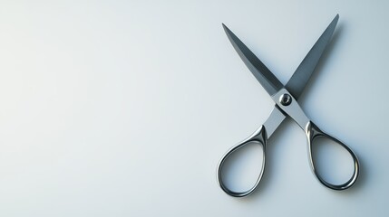 Scissors placed on a clean white background create a simple yet effective visual. The scissors stand out against the white background, emphasizing their design and functionality.