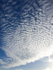 Photo of white clouds with blue sky. The weather is very sunny.