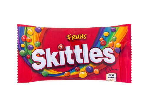 LONDON, UK - NOVEMBER 05, 2024: SKITTLES Original Fruity Dragee Candy mix of various fruit flavour on white background.