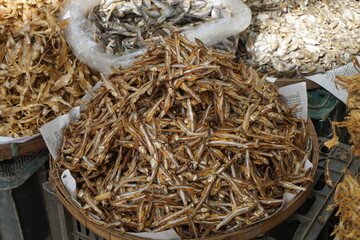 Closeup shot of mixed dried fish in a seafood market, Salted dried fish being sold at an Asian fish...
