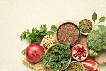 Different superfood products on light table, top view. Space for text
