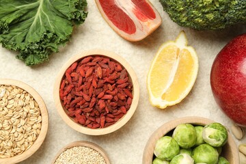 Different superfood products on light table, flat lay