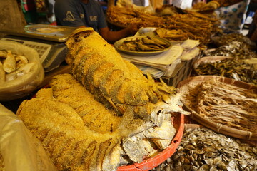 Closeup shot of mixed dried fish in a seafood market, Salted dried fish being sold at an Asian fish market, Freshly caught dried sea fish at a local market
