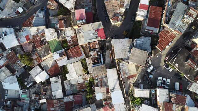 Aerial view of Caracas favelas, Venezuela &ndash; Dense hillside neighborhoods with colorful homes, urban sprawl, and vibrant local culture under a mountainous backdrop