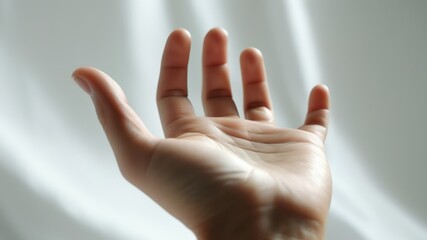 Open hand gesture conveying warmth, support, and connection in soft light, ideal for themes of communication and inclusion