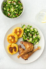 Chickpea cutlets with mixed salad with cucumbers and radishes, baked farm chicken legs