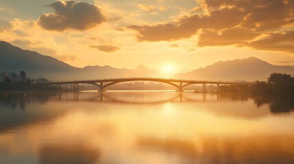 Fototapeta premium Golden Sunset Over Bridge And Mountain Cityscape