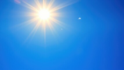 A bright, shining sun with rays of light emanating from its center, casting a warm glow on the clear blue sky with a few wispy clouds floating by.