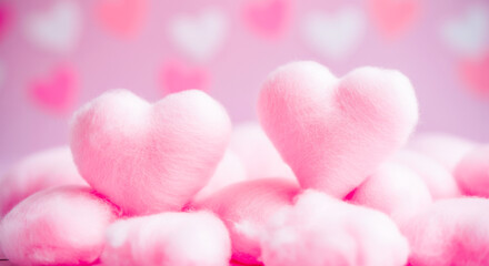 Obraz premium Soft pink heart-shaped cushions with blurred hearts background