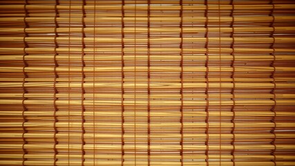 A Close-up of a Woven Bamboo Mat with a Natural Texture and Warm Brown Hues