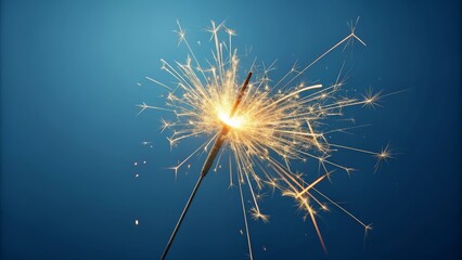 Obraz premium Sparkle Photography Single Burning Sparkler Against Blue Background, Celebration, Festive, Light Trails, Firework, Bright Sparkle Photography, Fireworks