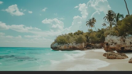 Tropical beach with turquoise water, palm trees, and white sand.