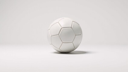 Soccer ball moving against plain white backdrop