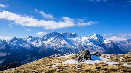 Fototapeta premium Spectacular Snowy Mountain Range Under Bright Blue Sky in Scenic Winter Landscape : Generative AI