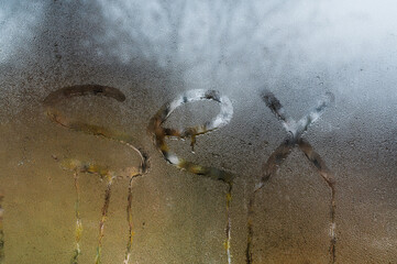 sex writing on wet glass.