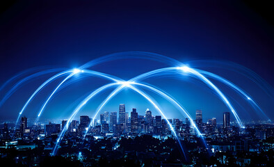 A wide shot of an urban cityscape at night, with glowing network connections linking buildings across the skyline, symbolizing technology and connectivity. 