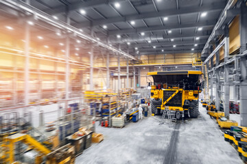 Maintenance fix service of industry truck, repair mining dump car in garage, aerial top view © Parilov