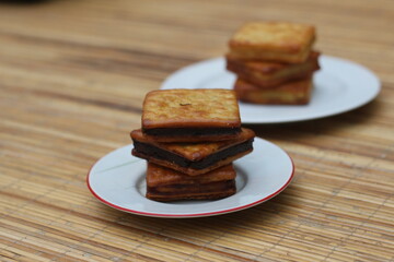 Sweet Chocolate Sandwich Crackers on a Wooden Table