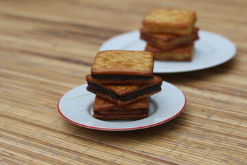Delicious Chocolate Filled Crackers on Wooden Table