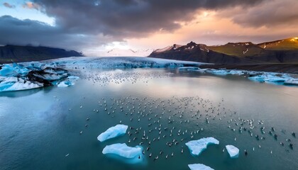 Fototapeta premium Glacial Lagoon Sunset Birds Icebergs Dramatic Sky Iceland Landscape