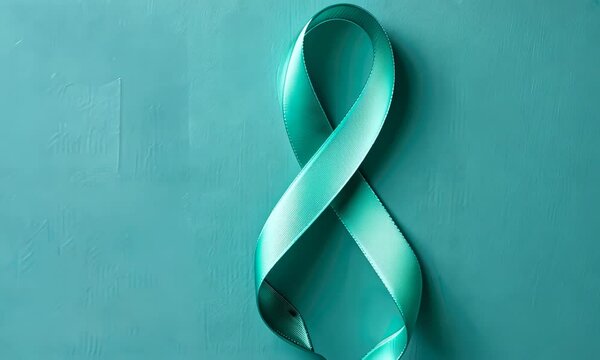 Teal ribbon on textured teal background, symbolizing awareness for specific causes