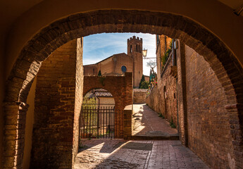alley of Siena with St. Domenico church in the background