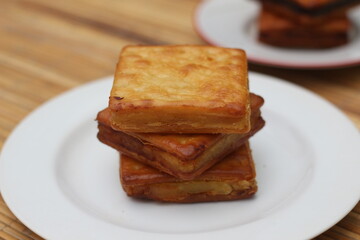 Delicious Golden Brown Crackers Stacked on a Plate