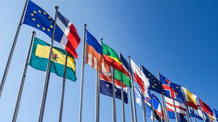 Obraz premium Diverse International Flags Waving Against Clear Blue Sky Symbolizing Global Unity and Cooperation : Generative AI