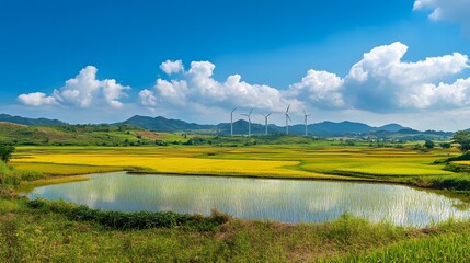 Serene Landscape Featuring Wind Turbines and Rice Paddies