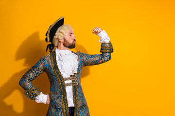 Person in noble classic attire posing confidently with bright yellow background