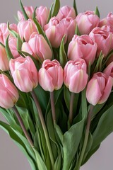 Obraz premium Beautiful bouquet of pink tulips arranged elegantly for a special occasion or celebration in a bright setting