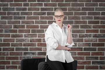 Portrait of a beautiful young caucasian woman with shaved head. Female cancer survivor. Smiling...