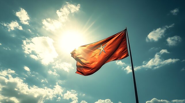 Dramatic View of Red Flag Against a Deep Blue Sky with Sunlight Piercing Through : Generative AI