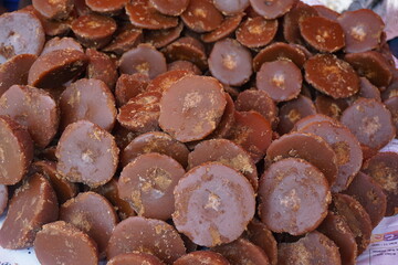 Organic date palm jaggery is being sold on the market, Organic Gur or Jaggery bar or cubes, Authentic sweet Jaggery cubes made with sugarcane,  Brown palm sugar jaggery