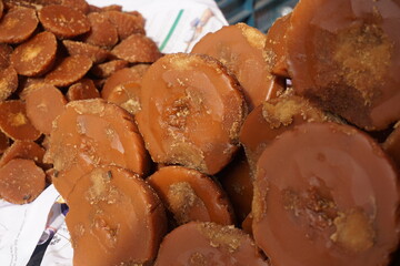Organic date palm jaggery is being sold on the market, Organic Gur or Jaggery bar or cubes, Authentic sweet Jaggery cubes made with sugarcane,  Brown palm sugar jaggery