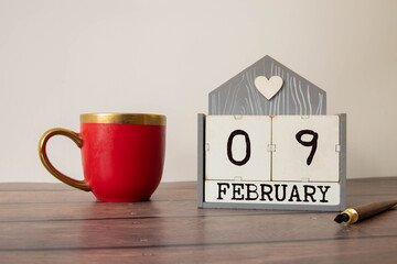 Save the Date written on a calendar - February 09
