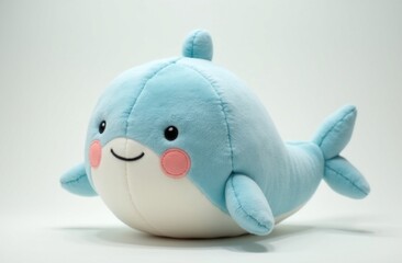 Fototapeta premium Blue whale plush toy with soft texture, pink cheeks, and a smiling face, set against a plain white background
