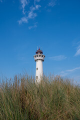 Lighthouse in the dunes of the Dutch town of Egmond aan Zee