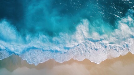Fototapeta premium Aerial View of Ocean Waves Crashing on Sandy Beach