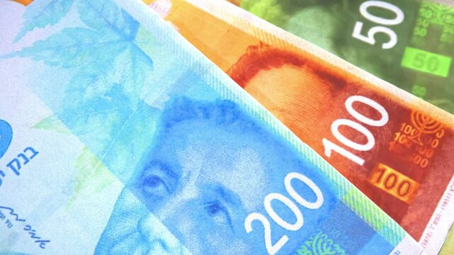 Close up of an Israeli Currency Shekel 4k Footage, business and finance concept.