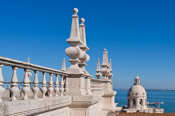 Pinnacle spires decorated roof of Monastery of Sao Vicente de fora with the background of the dome...